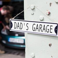 Dad's Garage Embossed Metal Sign 40x10